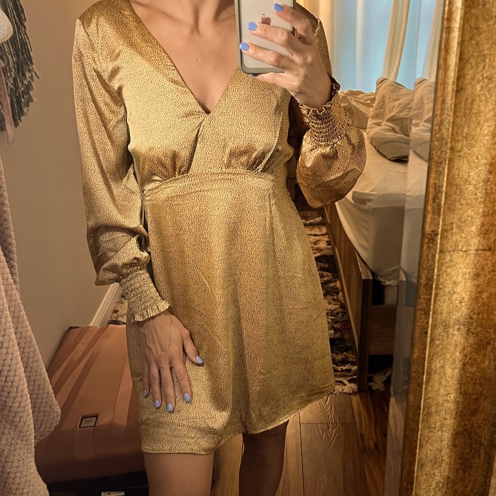 Black and gold polka dot mini dress